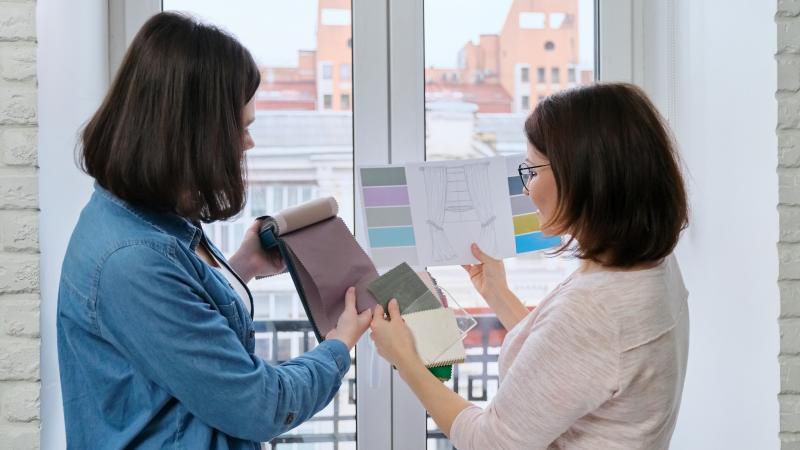 Two people looking at design options