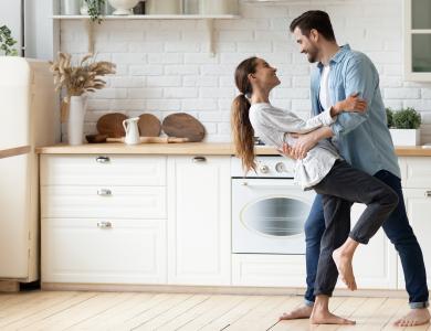 Couple dancing in kitchen