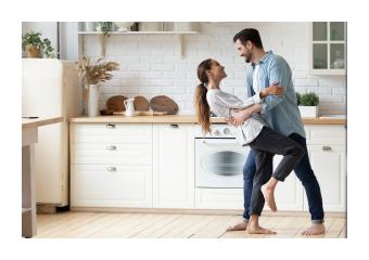 Couple dancing in kitchen
