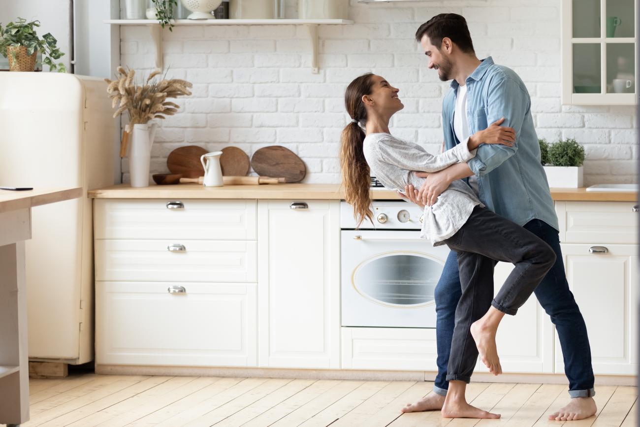 Couple dancing in kitchen